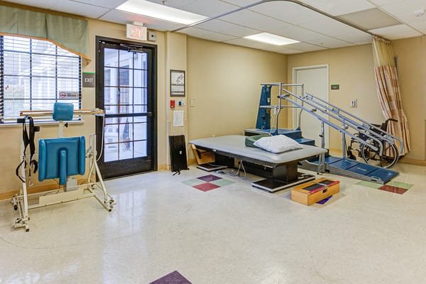 Physical therapy room with rehabilitation equipment