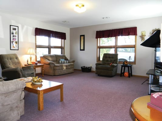 Spacious living room with comfortable seating and natural light