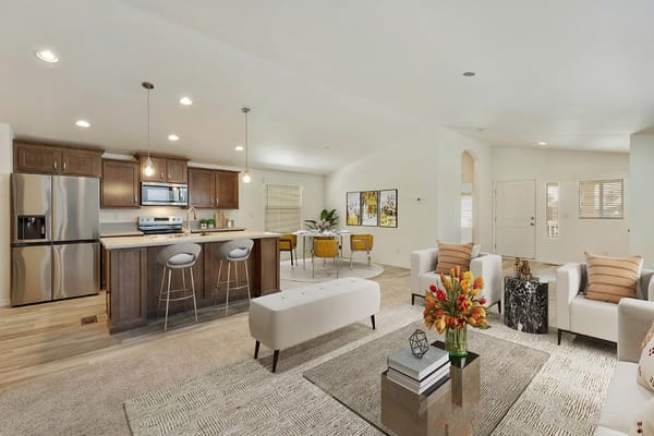 Modern living room with kitchen in Tropicana Palms 55+ Community
