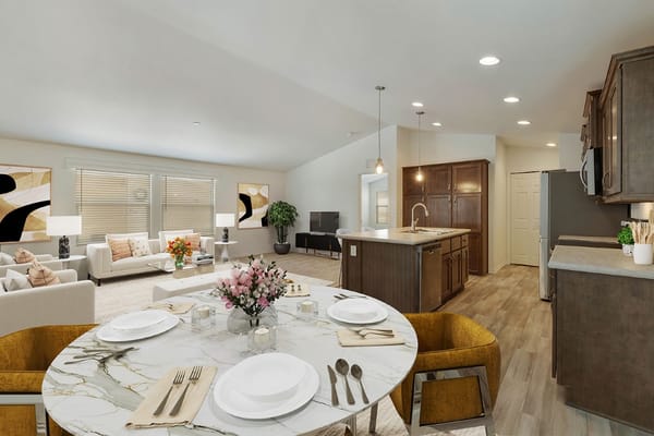 Open concept living room and kitchen with dining table