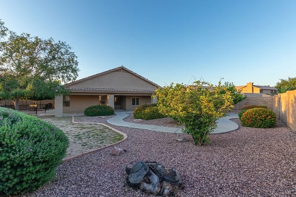 Spacious garden with plants and pathways at Unique Family to Family Assisted Living Home