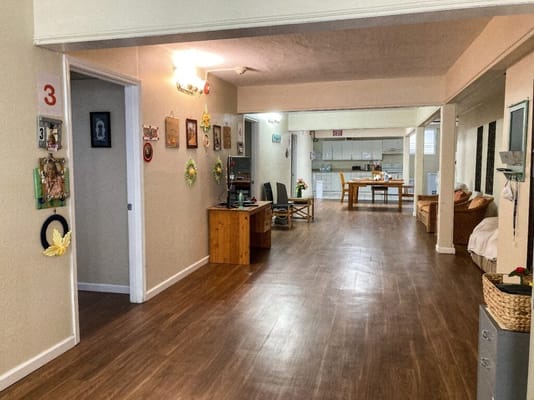 Interior view of the common area with wooden flooring and decorations