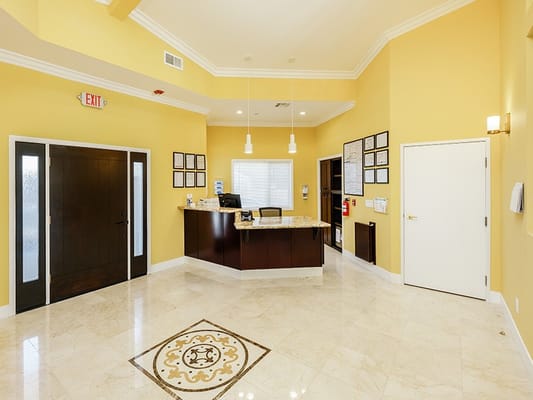 Bright interior reception area with a marble floor