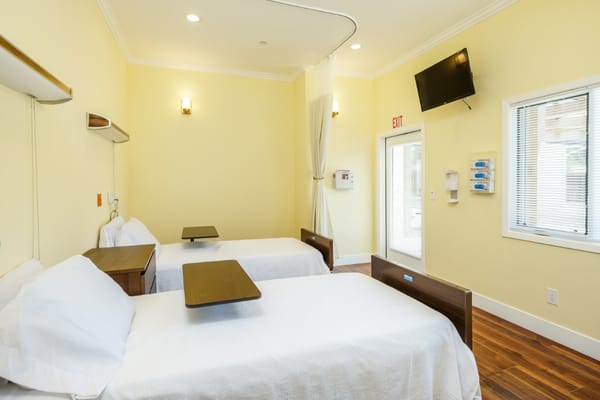 Bright, well-furnished resident room with two beds