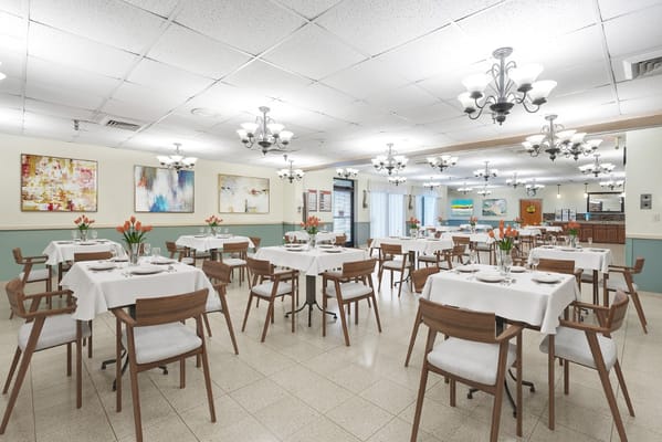 Dining area with tables set for residents