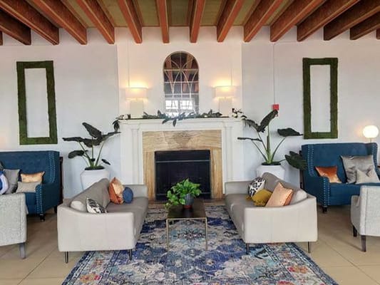 Spacious living room with comfortable seating and decorative plants