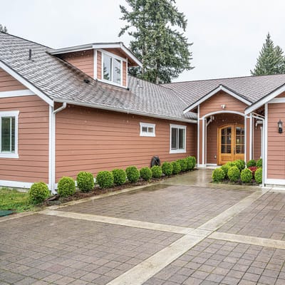 Exterior view of a senior living facility with landscaped entrance