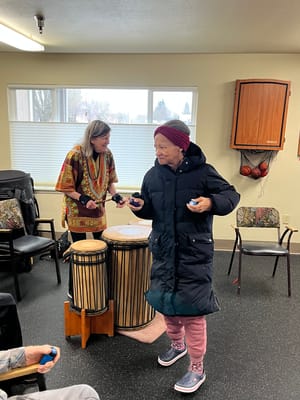 Residents participating in a music activity indoors
