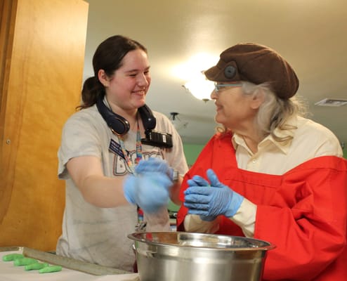 Staff and resident participating in an activity together