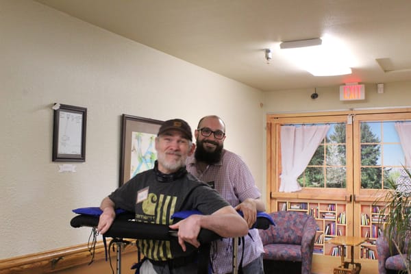 Residents and staff interacting in a common area
