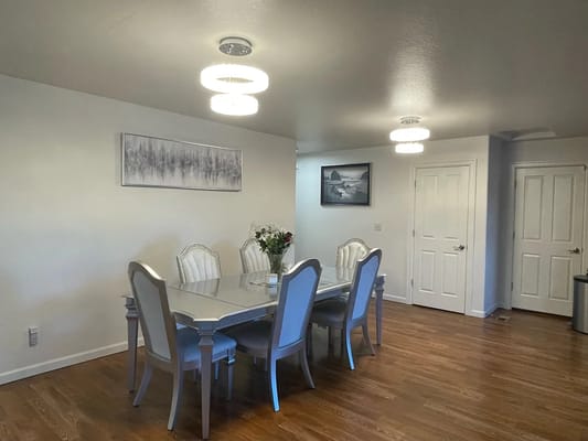 Bright dining area with a large table and chairs