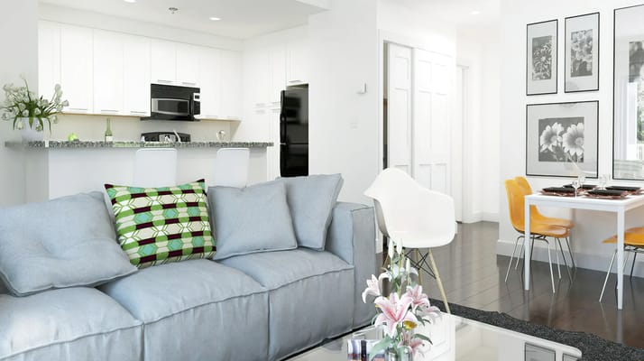Bright interior view of a modern living room with kitchen