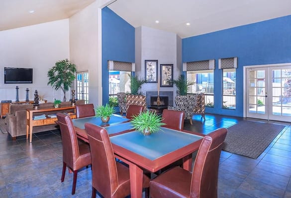 Bright common area with seating and dining tables