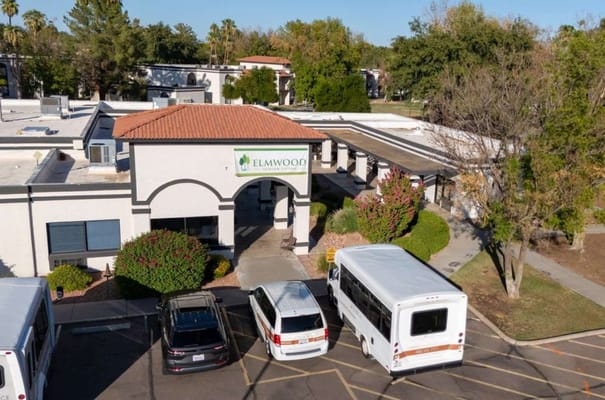 Aerial view of Elmwood Senior Living entrance and parking area