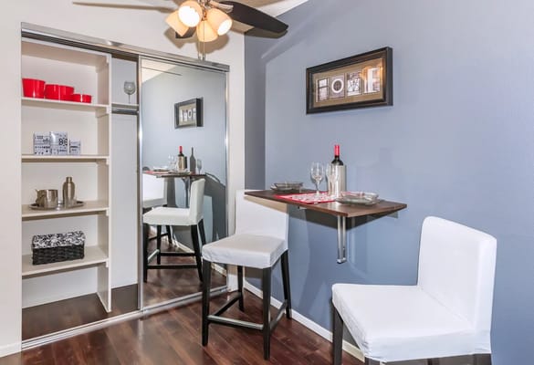 Modern apartment interior with bar seating and decor