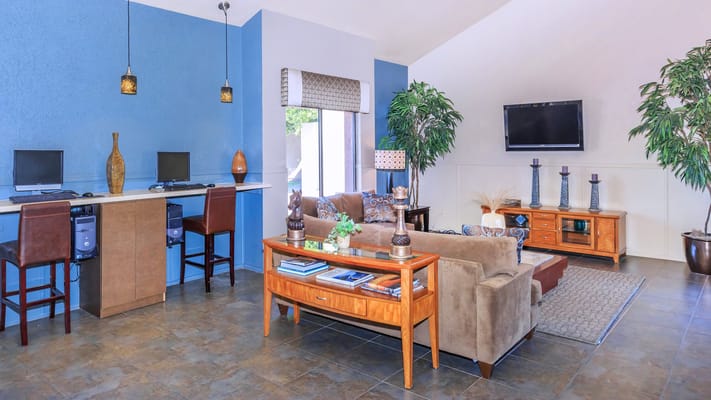 Bright and inviting common area with seating and computers