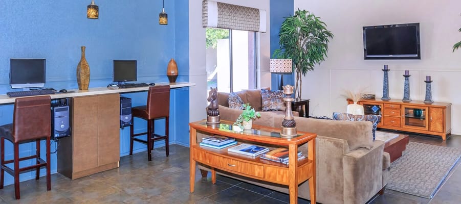 Bright common area with seating and computers