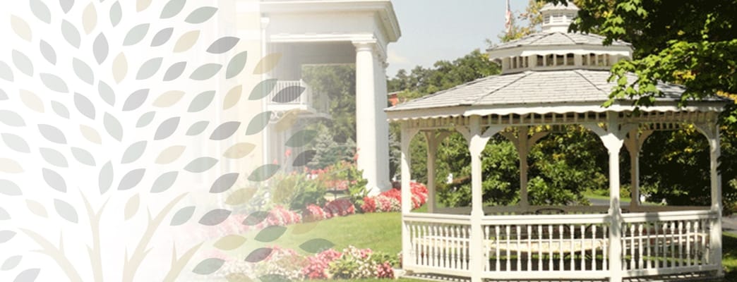 A gazebo surrounded by flowers in a garden