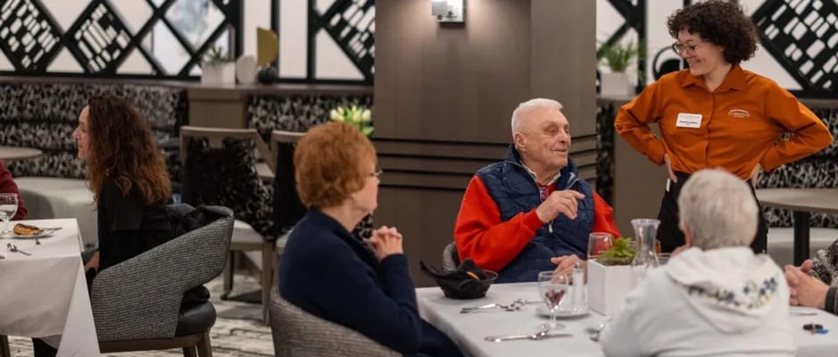 Residents enjoying a meal in a dining room