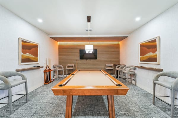 Interior common area with a pool table and seating