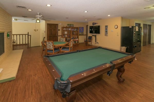 Common area with a pool table and seating