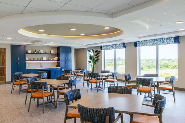 Bright common area with tables and chairs