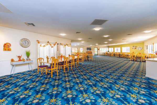 Bright common area with dining tables and decorative elements