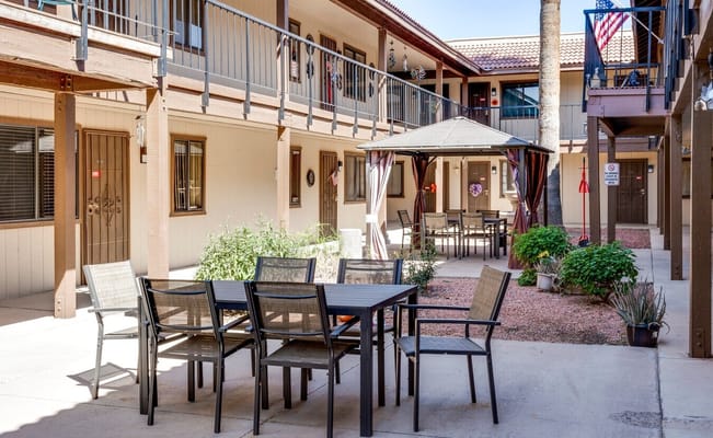 Outdoor seating area with a gazebo in a courtyard