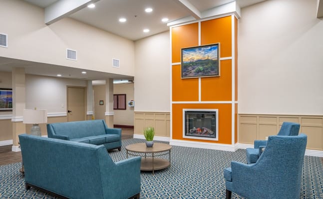 A cozy common area with seating and artwork