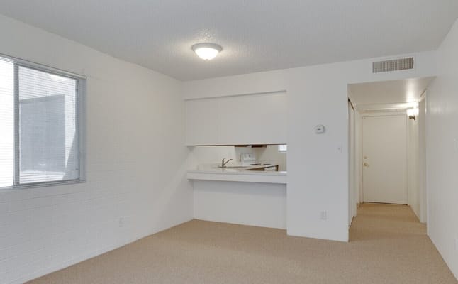 Living room interior with kitchenette at Hacienda De Los Arcos