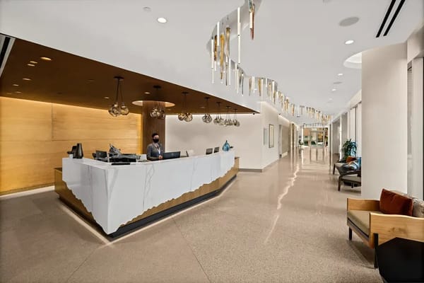 Lobby area of Mirabella at ASU with staff member