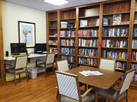 Comfortable library area with bookshelves and seating