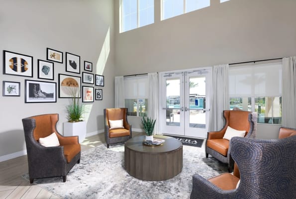 Bright living room with cozy seating and artwork