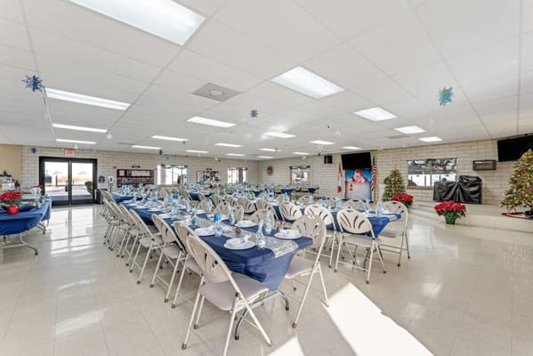 Dining area set up for a festive event with decorations