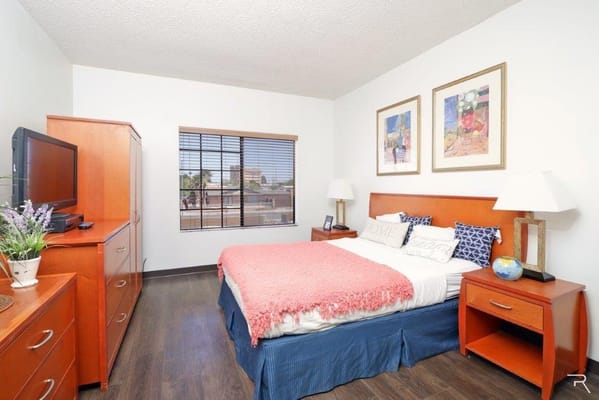 Cozy private resident room with bed and furniture