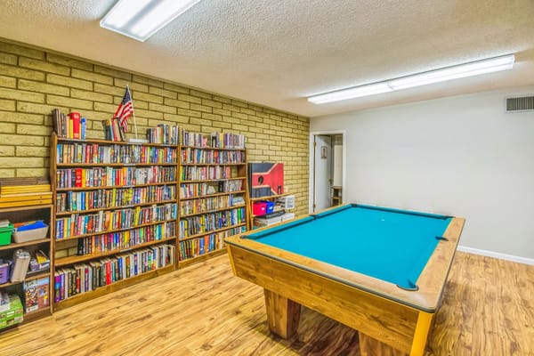 Inside view of a common area with a pool table
