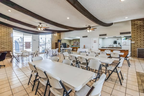 Interior view of a common area with tables and chairs