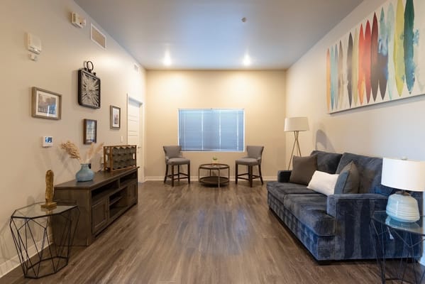 Cozy living room with a sofa, chairs, and decorative elements