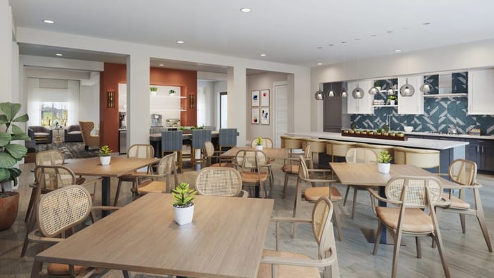 Bright and modern common area with seating and dining tables