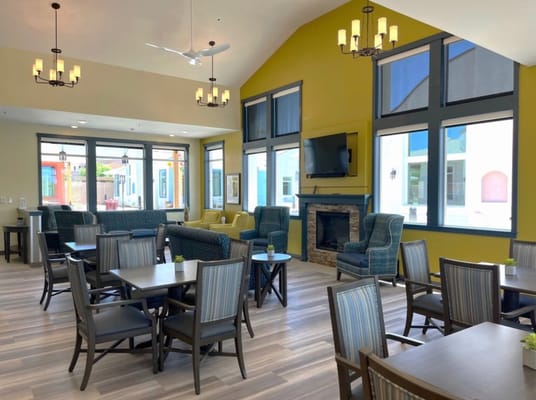 Spacious common area with seating and a fireplace