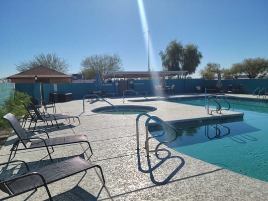 Swimming pool area with lounge chairs at the resort