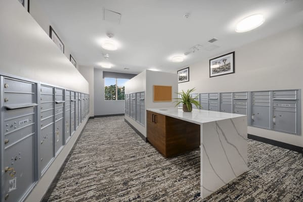 Interior view of a residential mail area with mailboxes