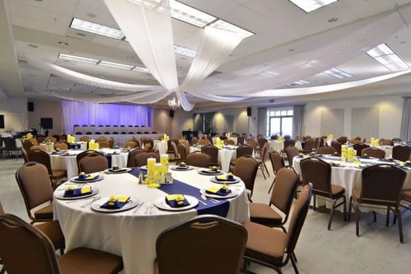 Event hall set up with round tables and decorations