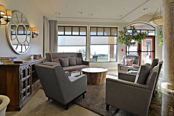 Comfortable seating area with natural light and decorative elements.