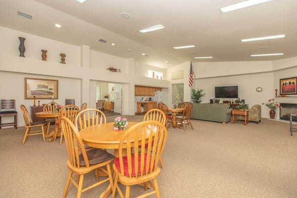 Common dining area with wooden tables and chairs