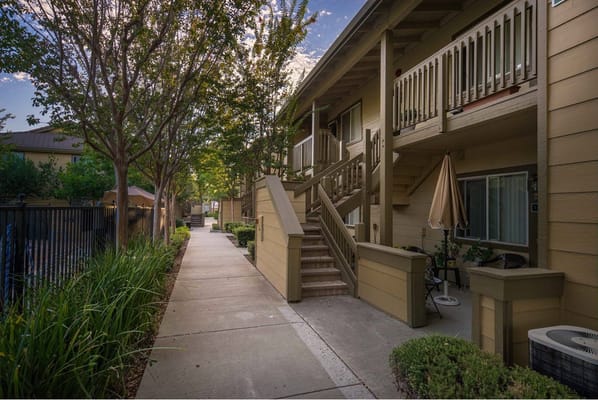 Pathway leading to senior apartments with greenery
