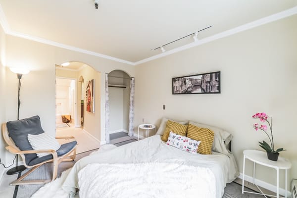 Cozy bedroom with bright decor and natural light