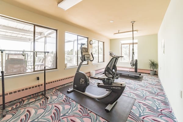 Well-equipped fitness room with exercise machines