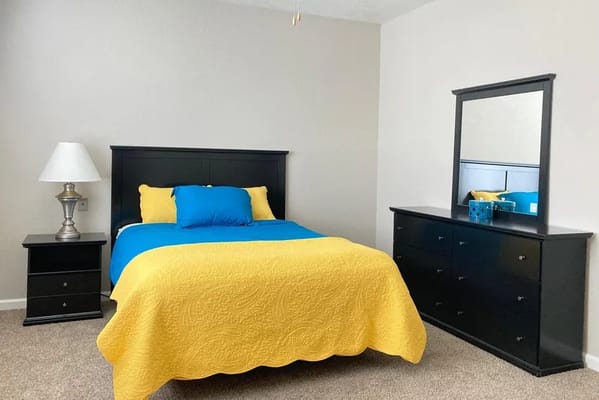 Cozy private resident room with yellow accents