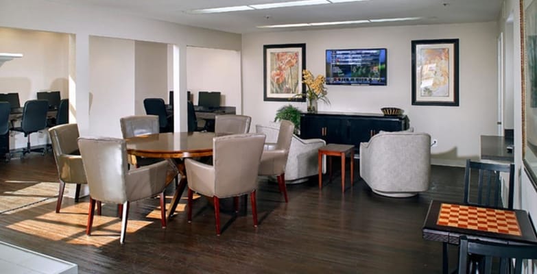 Cozy common area with seating and a TV